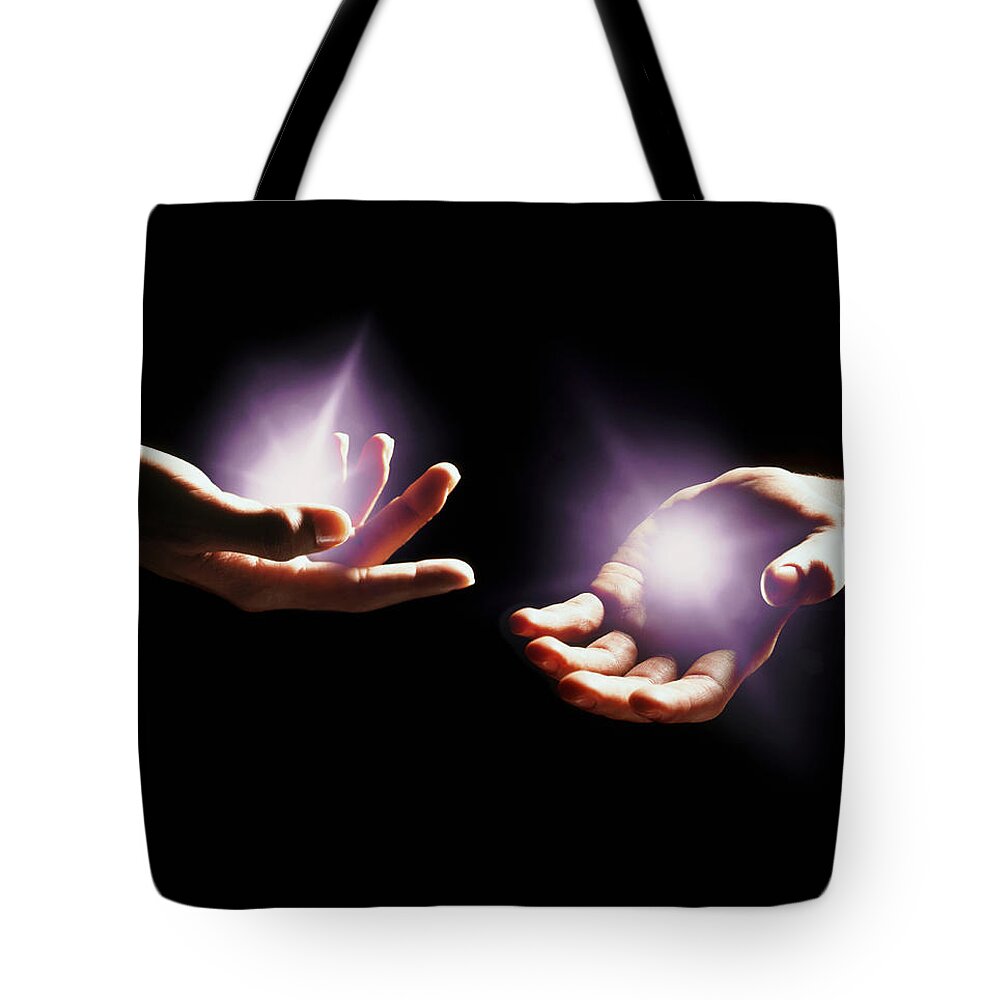 Palm Of Hand Tote Bag featuring the photograph Hands With Light Emminating From Them by Hans Neleman