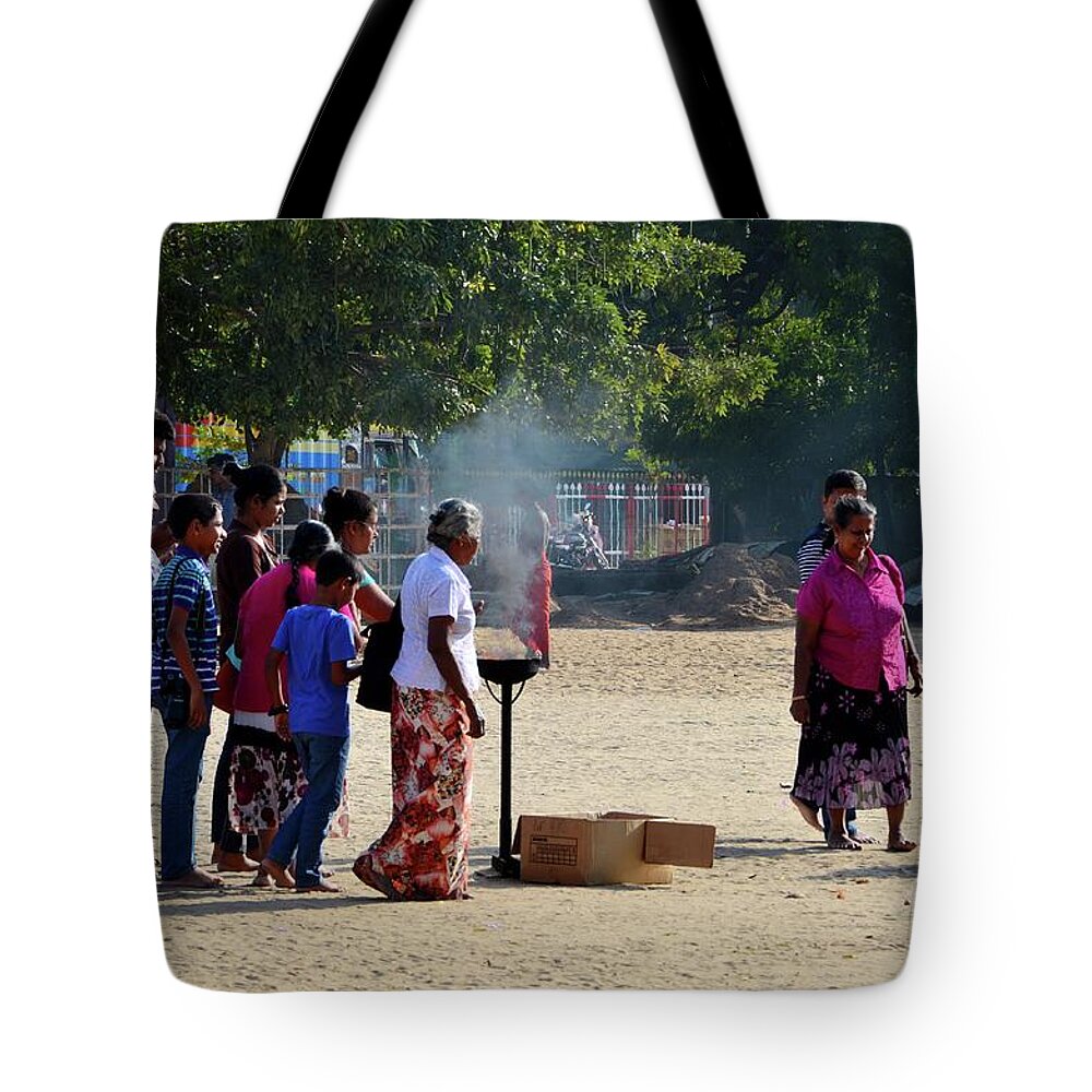 Hindu Tote Bag featuring the photograph Hindu Tamil worshippers make offerings at compound of Nallur Kandaswamy temple Jaffna Sri Lanka by Imran Ahmed