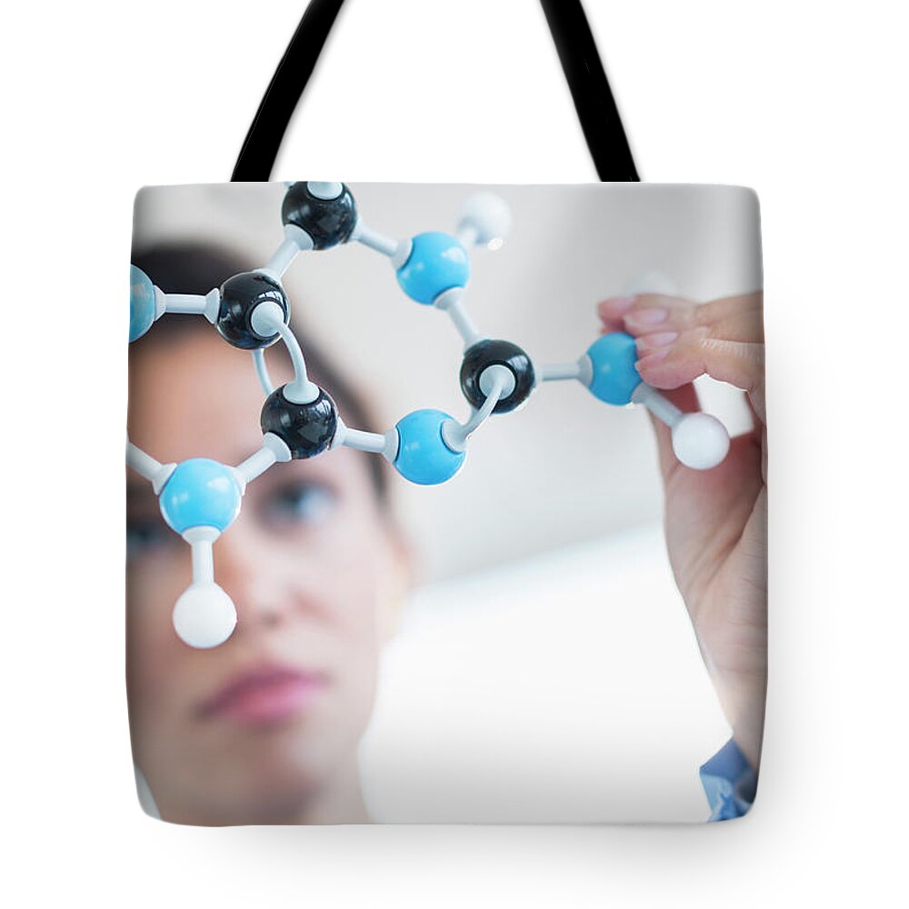 Expertise Tote Bag featuring the photograph Hispanic Scientist Examining Molecular by Jgi/tom Grill