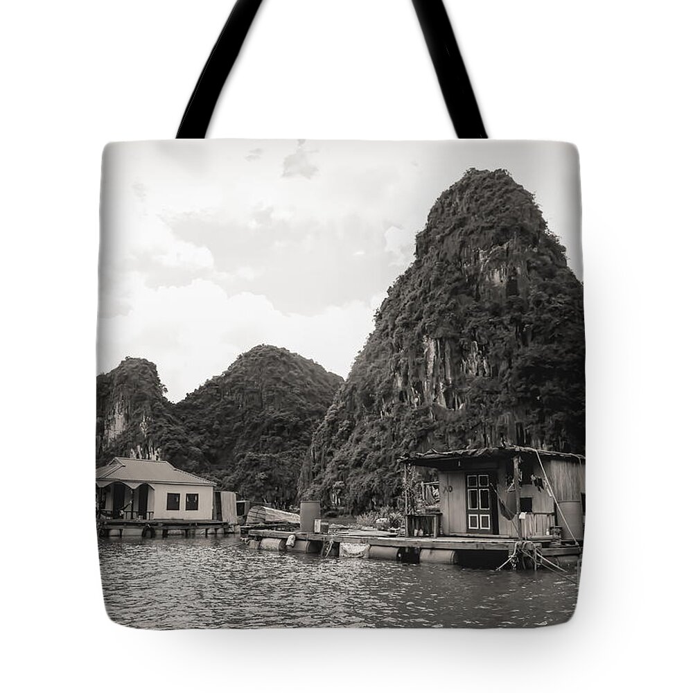 Vietnam Tote Bag featuring the photograph Homes on Ha Long Bay Boat People by Chuck Kuhn