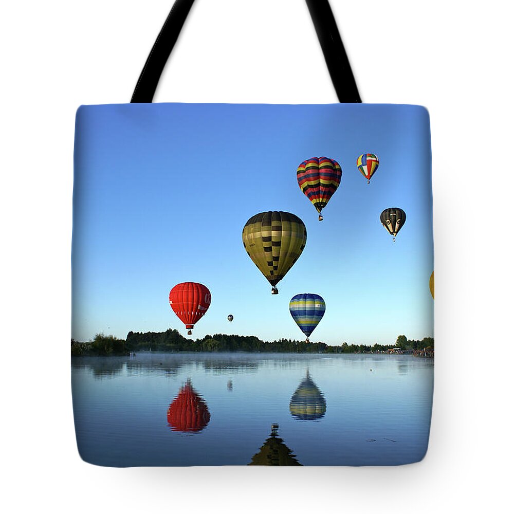 Clear Sky Tote Bag featuring the photograph Hot Air Balloons Reflected In Lake by Brenda Anderson