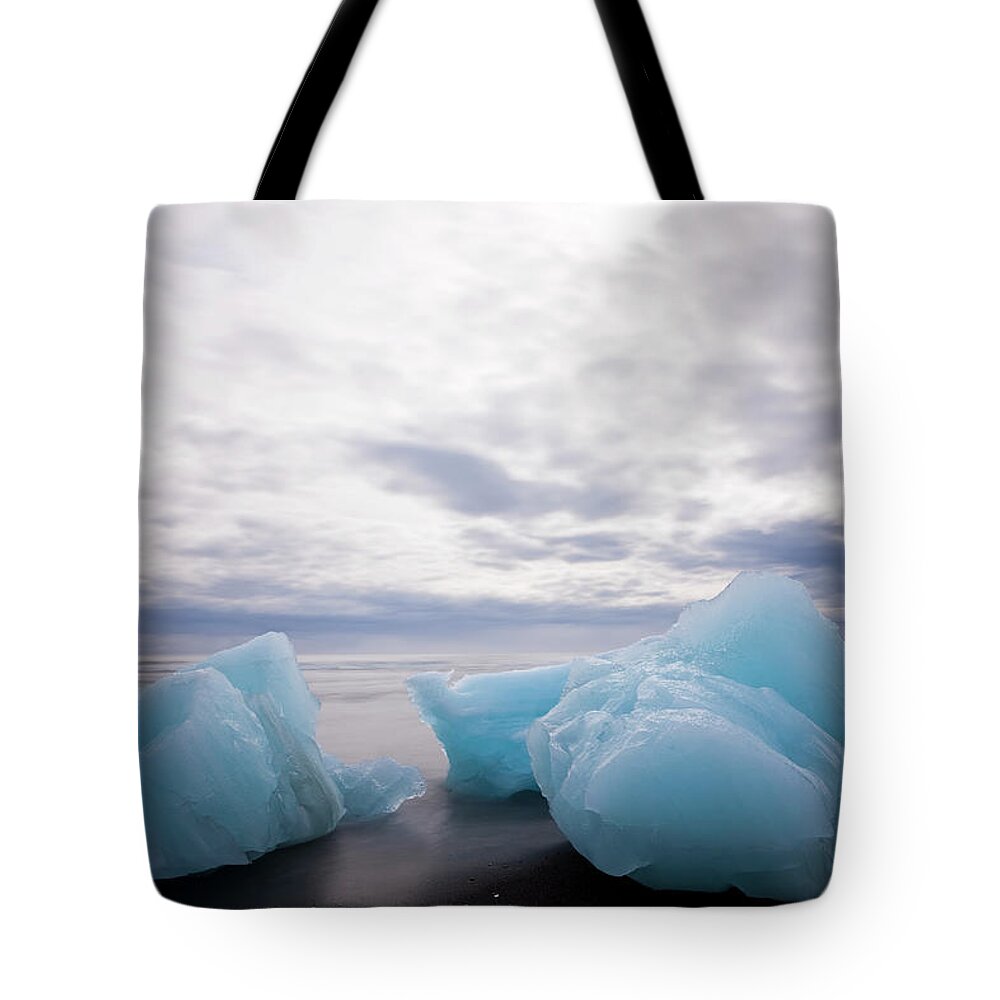 Iceberg Tote Bag featuring the photograph Icebergs On Beach Jokulsarlon Glacial by Peter Adams