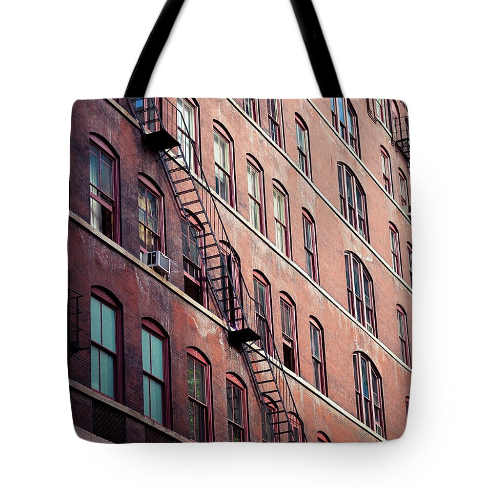 Security Tote Bag featuring the photograph Industrial Building And Fire Escape by Images By Jonathanrobsonphotography.com