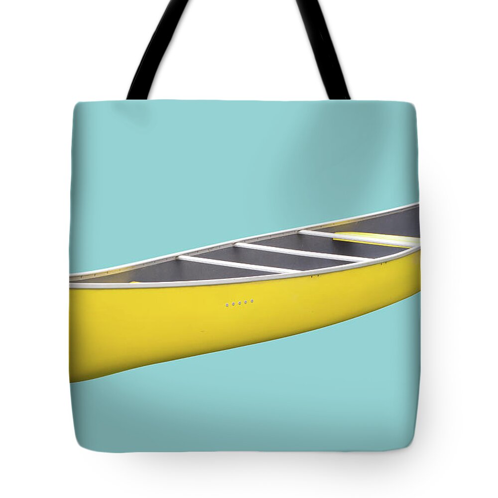 Recreational Pursuit Tote Bag featuring the photograph Isolated Yellow Canoe On Blue Background by 3dvd