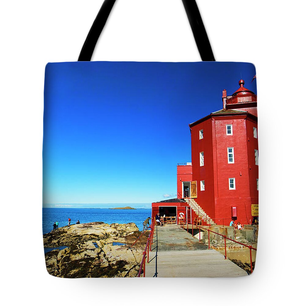 Security Tote Bag featuring the photograph Kjeungskjæret Lighthouse Outside by Audun Bakke Andersen