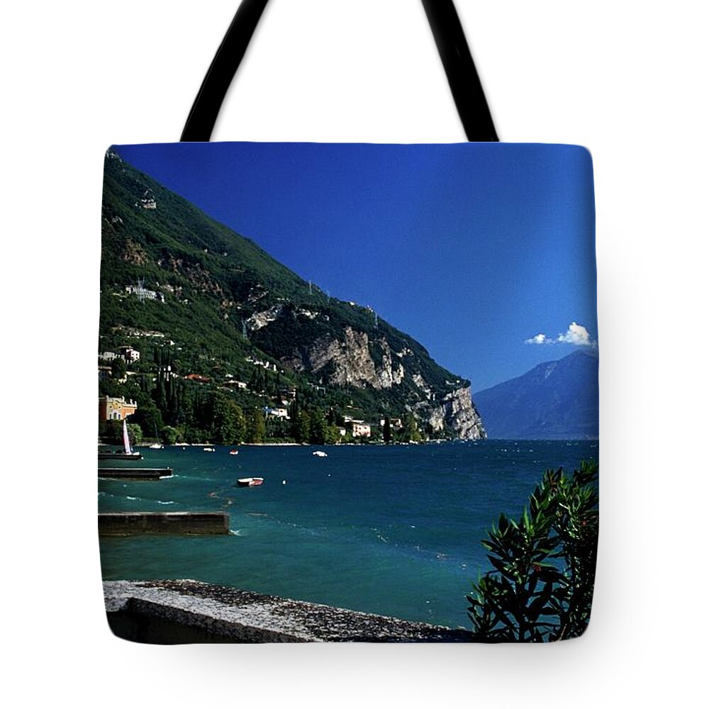Clear Sky Tote Bag featuring the photograph Lake Garda Surrounded By Buildings And by Design Pics