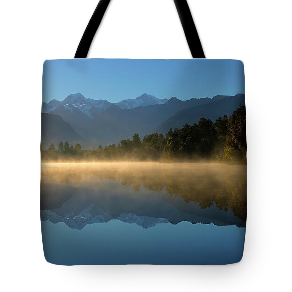 Lake Matheson Tote Bag featuring the photograph Lake Matheson Morning by Peter Kennett