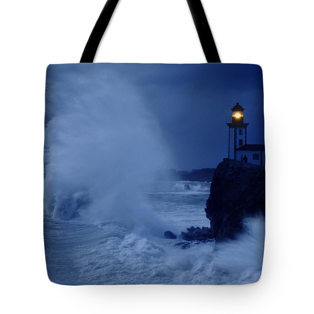 Estock Tote Bag featuring the digital art Lighthouse And Rough Sea by Giovanni Simeone