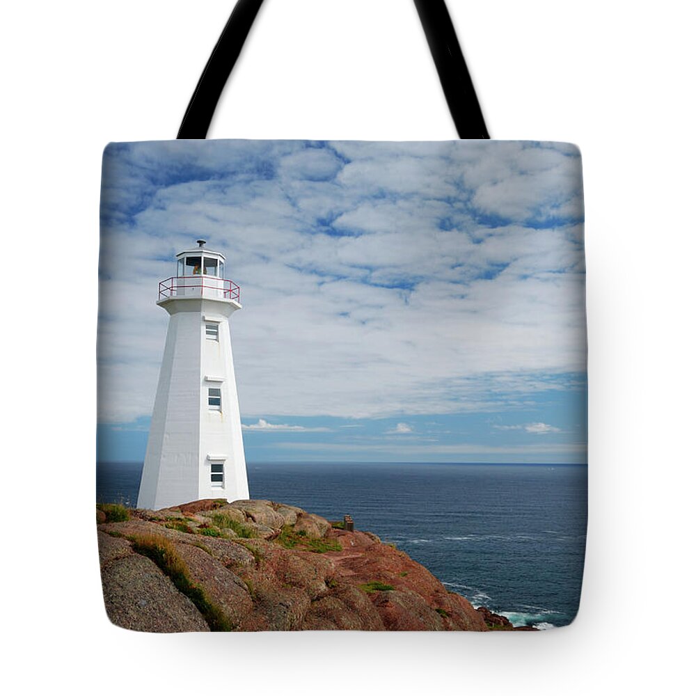 Water's Edge Tote Bag featuring the photograph Lighthouse by Mmac72