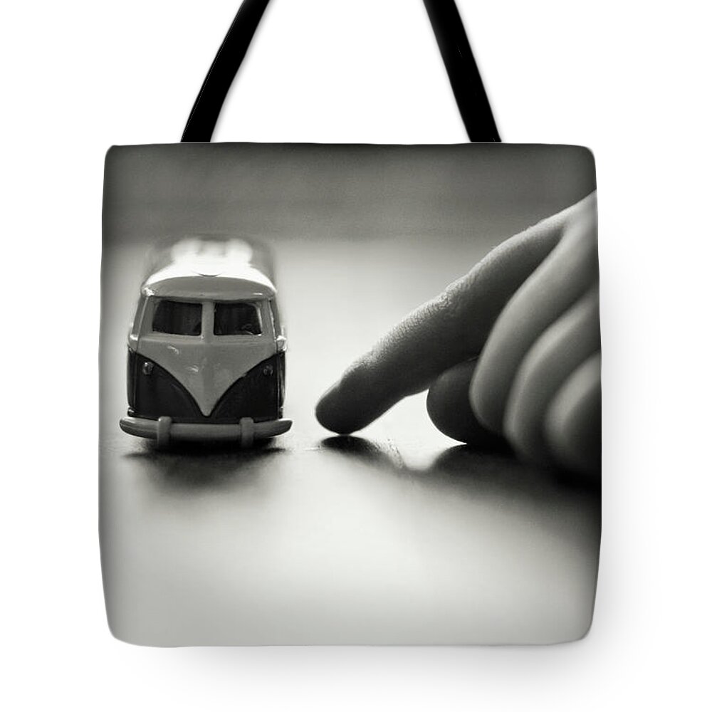 Child Tote Bag featuring the photograph Little Boys Hand With Toy Camper Van by Images By Victoria J Baxter