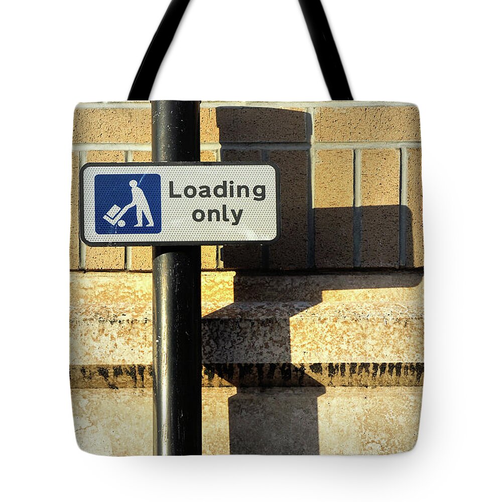 Brick Tote Bag featuring the photograph Loading only sign by Tom Gowanlock