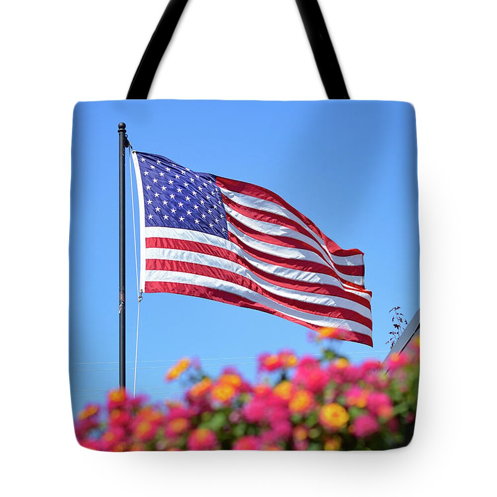 American Flag Tote Bag featuring the photograph Long May She Wave, Editor's Favorite, National Geographic Your Shot by Brian Tada