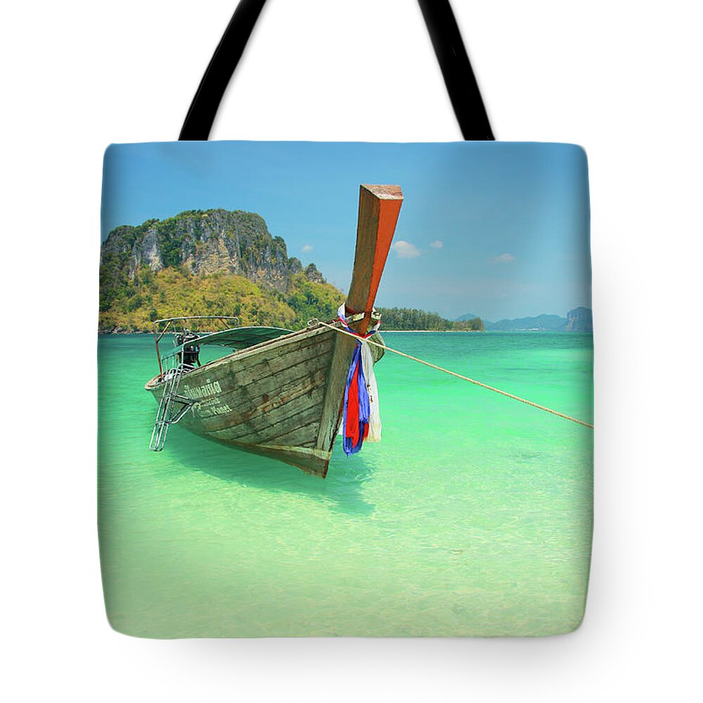 Southeast Asia Tote Bag featuring the photograph Longtail Boat And Island Outcrop At Tup by Peter Unger