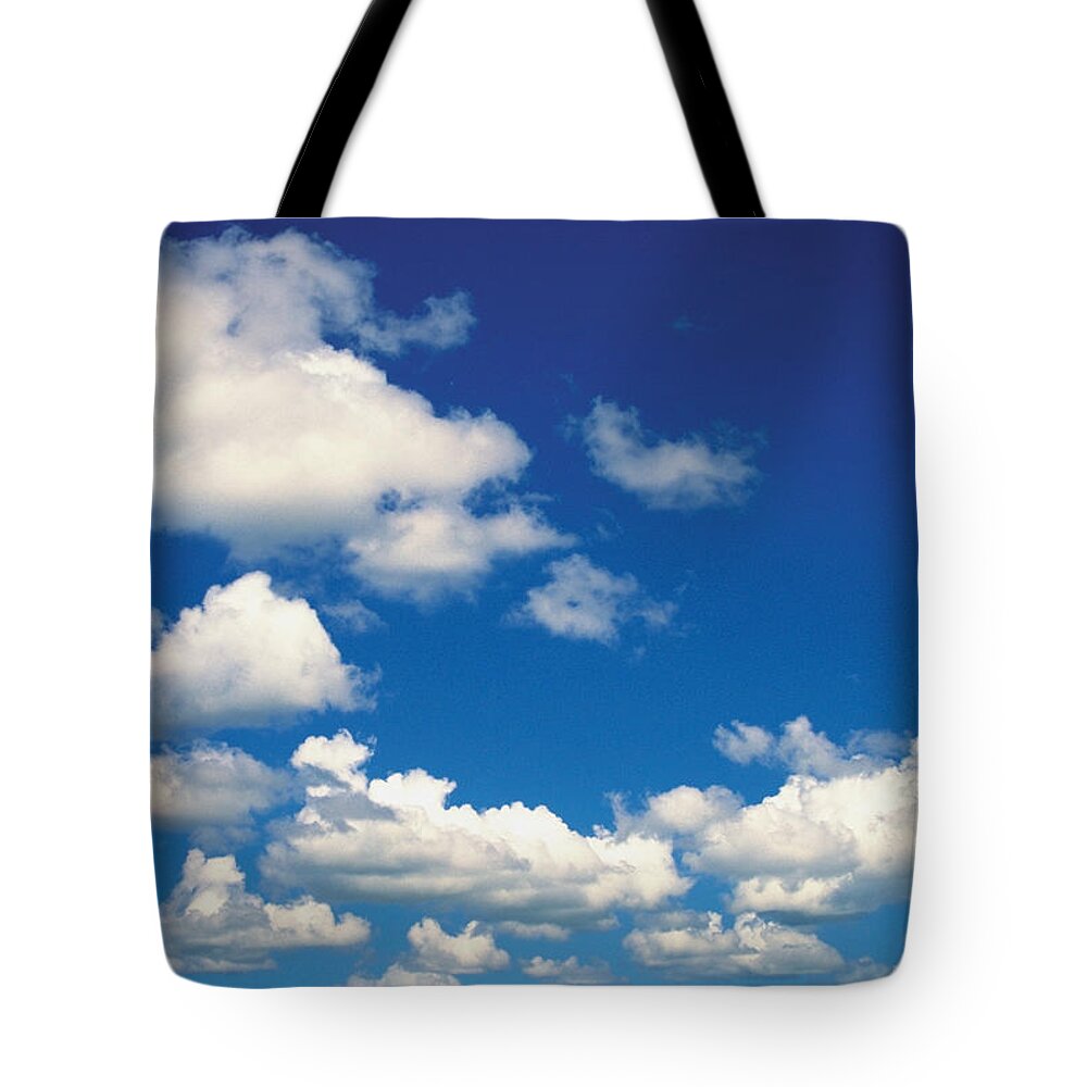 Scenics Tote Bag featuring the photograph Low Angle View Of Cumulus Clouds In The by Medioimages/photodisc