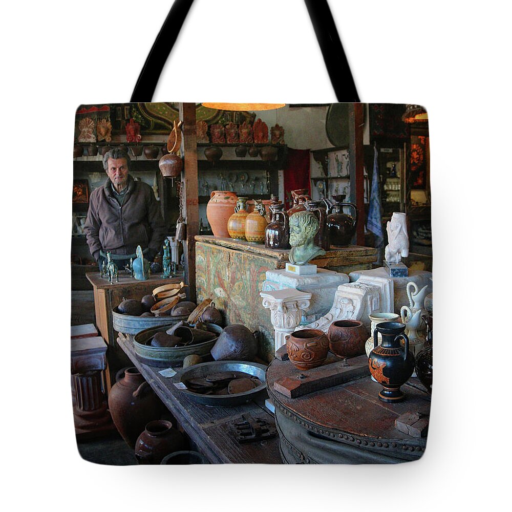 Greece Tote Bag featuring the photograph Man in Shop in Delphi by M Kathleen Warren