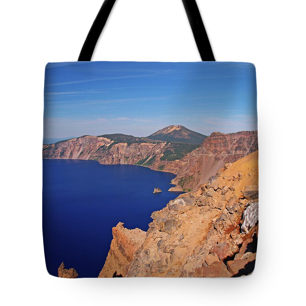 Crater Lake Tote Bag featuring the photograph Man On Rim Of Crater Lake by Matt Champlin