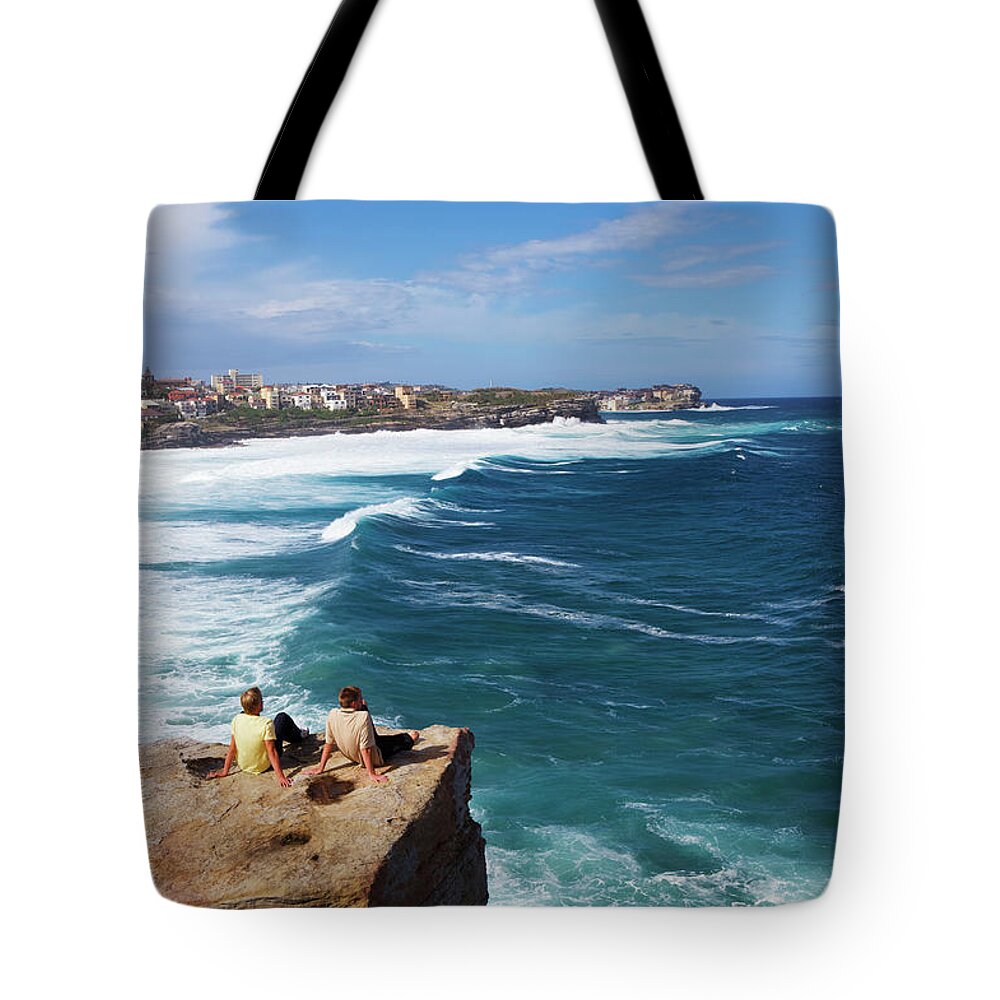 Scenics Tote Bag featuring the photograph Men On Sea Rocks At Bronte Beach by Oliver Strewe