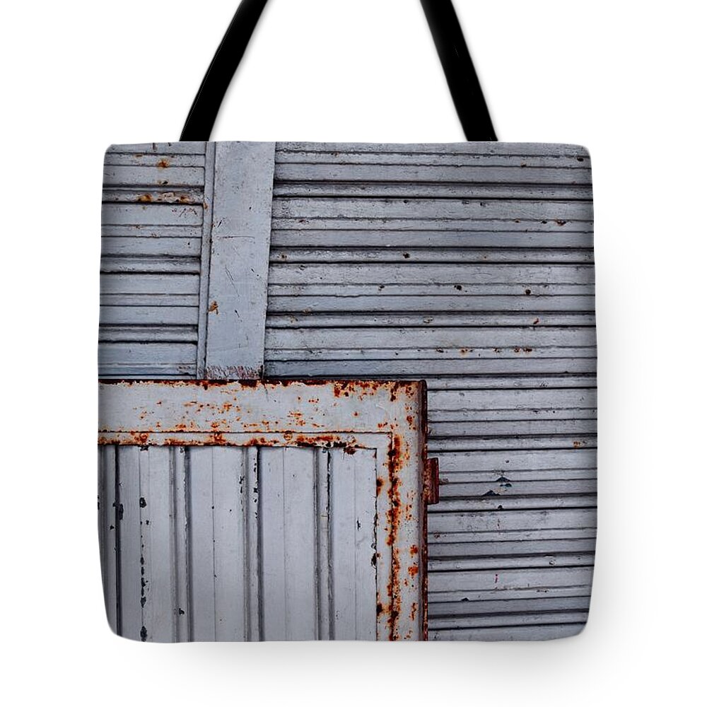 Metal Security Gates Tote Bag featuring the photograph Metal Security Gates by Debra Grace Addison