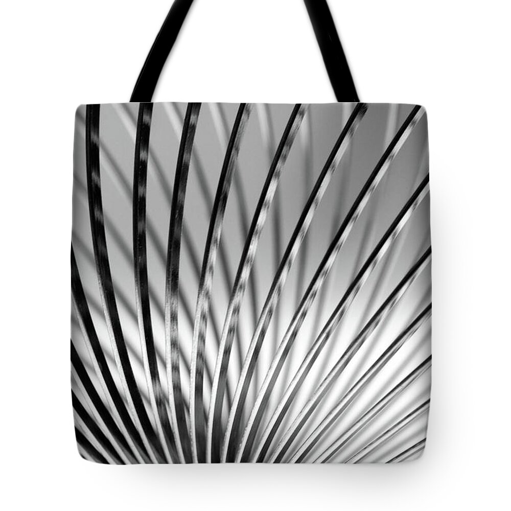 Full Frame Tote Bag featuring the photograph Metal Slinky by Deceptive Media