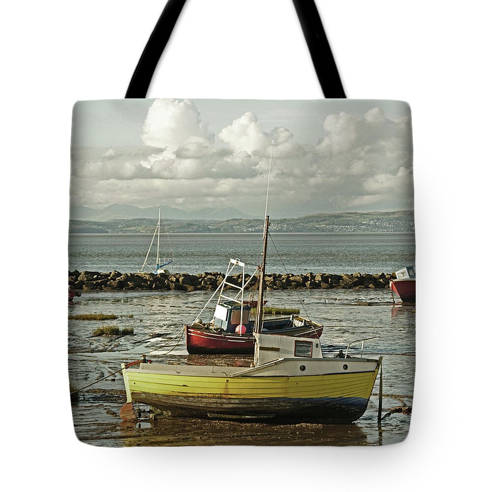 Morecambe Tote Bag featuring the photograph MORECAMBE. Boats On The Shore. by Lachlan Main