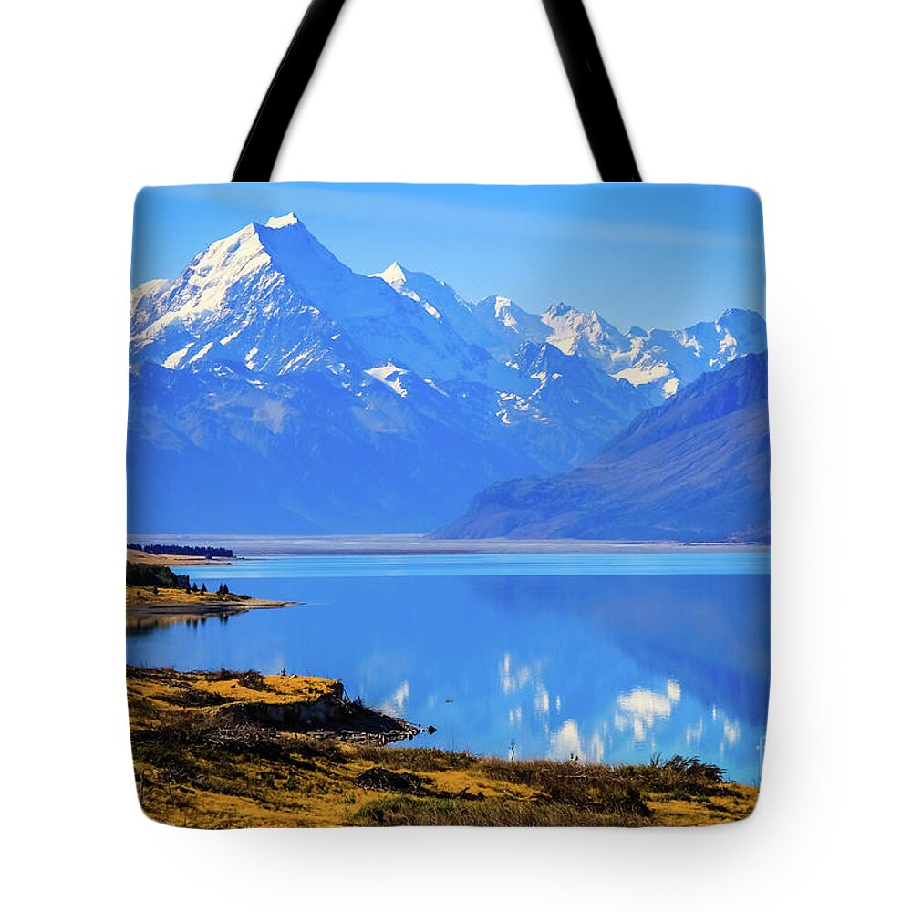 Mountain Tote Bag featuring the photograph Mount Cook overlooking Lake Pukaki, New Zealand by Lyl Dil Creations