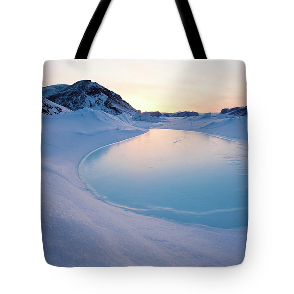 Melting Tote Bag featuring the photograph Mountains At Sunset And Melting Sea Ice by Justin Lewis