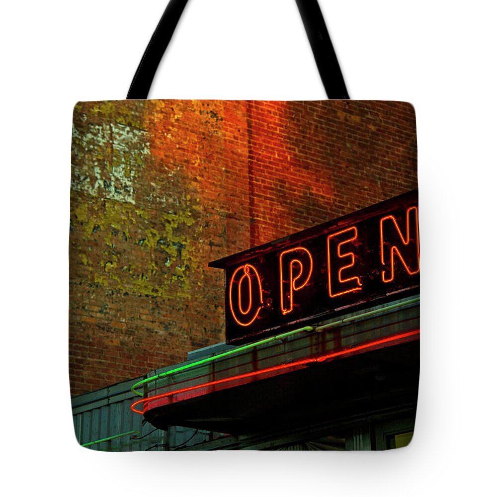 Built Structure Tote Bag featuring the photograph Neon Open Sign On Old Diner Hotel by Matt Champlin