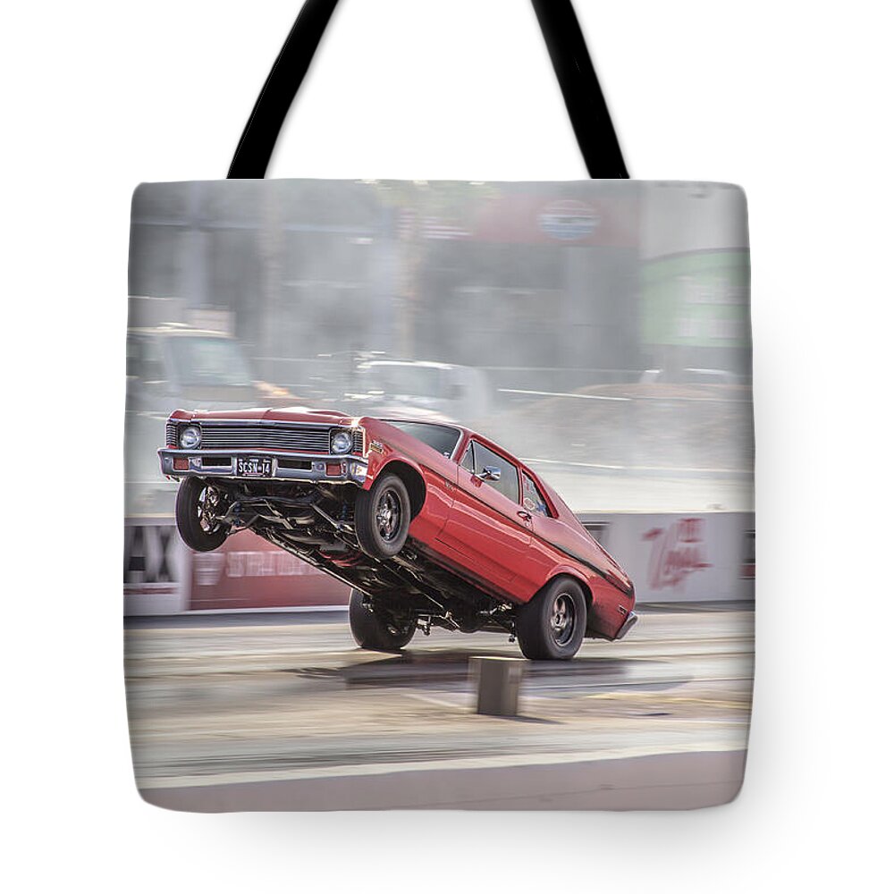 Nova Tote Bag featuring the photograph Nova Wheels up by Darrell Foster