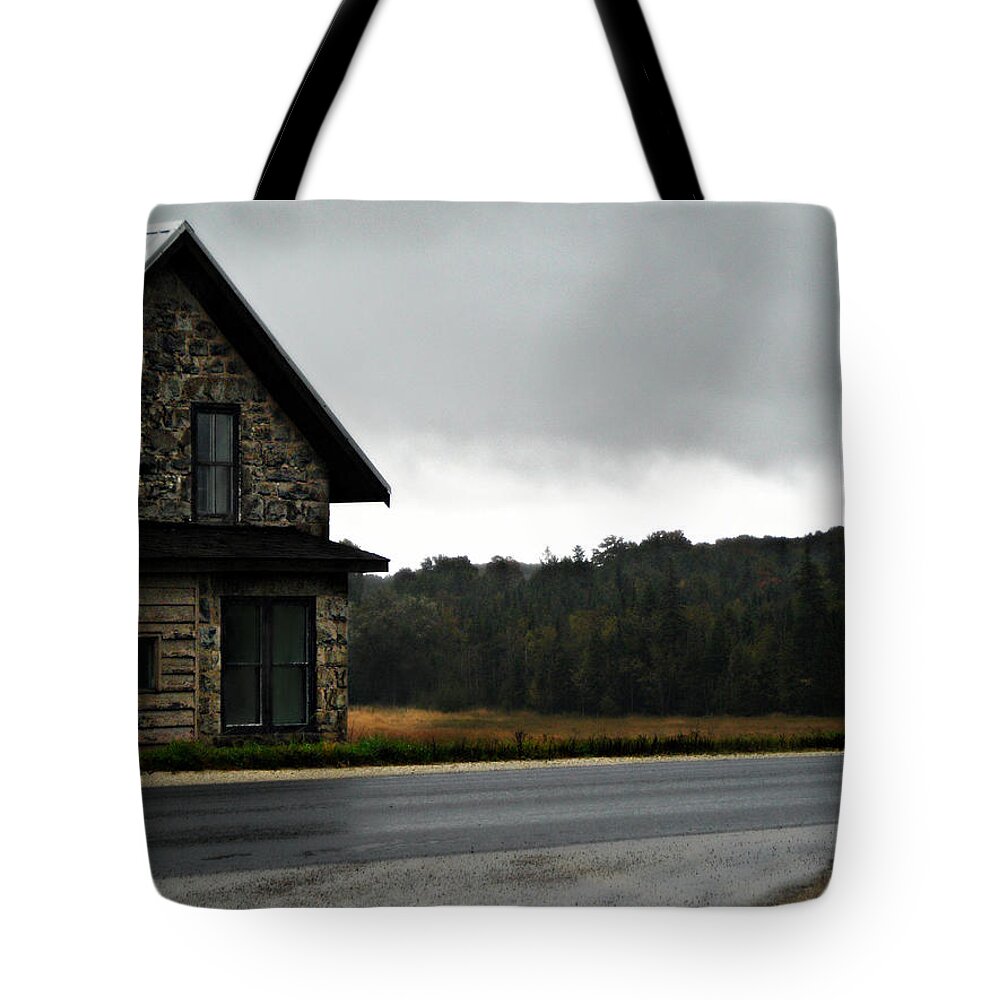 On A Cloudy Corner Tote Bag featuring the photograph On A Cloudy Corner by Cyryn Fyrcyd