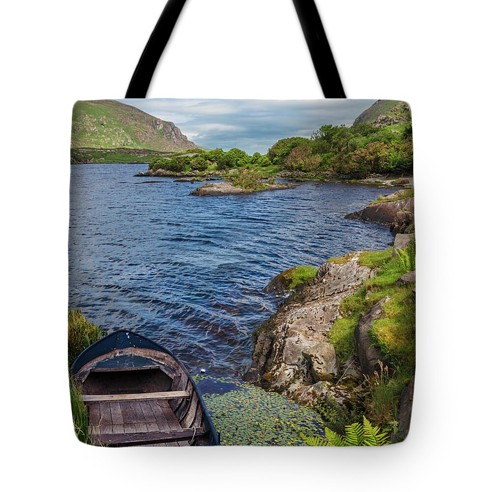 Boats Tote Bag featuring the photograph On a Lake of Blue by Debra and Dave Vanderlaan