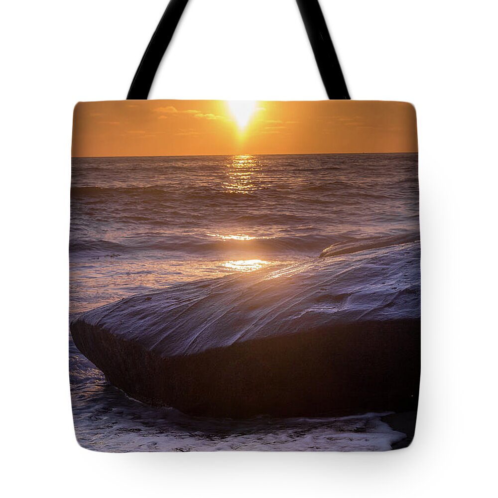 Beach Tote Bag featuring the photograph Orange Skies and Purple Rocks by Aaron Burrows