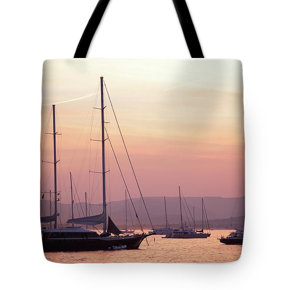 Orange Color Tote Bag featuring the photograph Pastel Dusk Sky And Yachts by Secablue