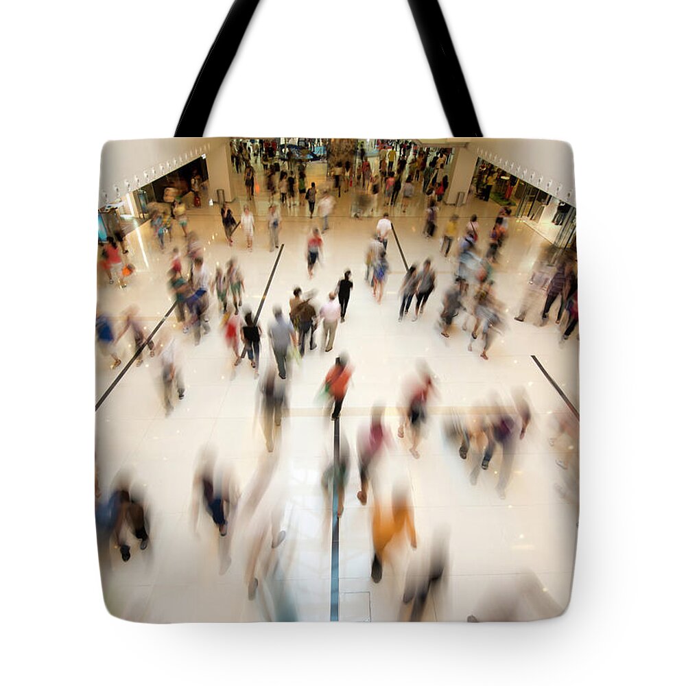 Crowd Tote Bag featuring the photograph People Walking In Shopping by Benimage