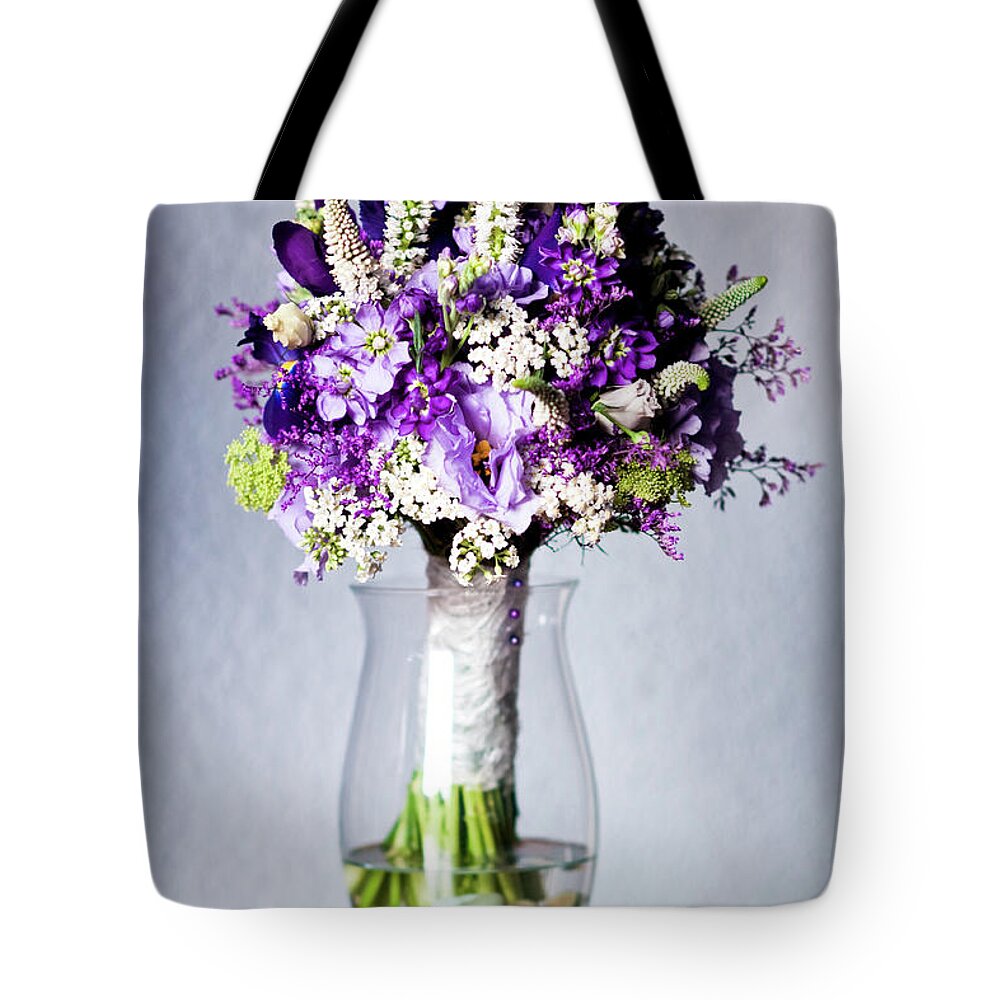 Arrangement Tote Bag featuring the photograph Perfect bridal bouquet for colorful wedding day with natural flowers. by Joaquin Corbalan