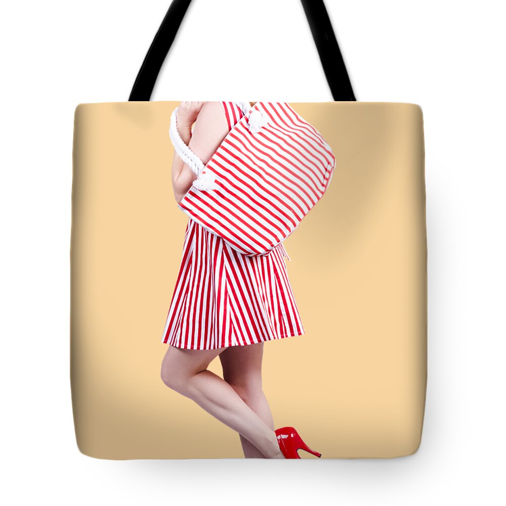 Shopper Tote Bag featuring the photograph Pin up girl wearing stripped red dress holding bag by Jorgo Photography