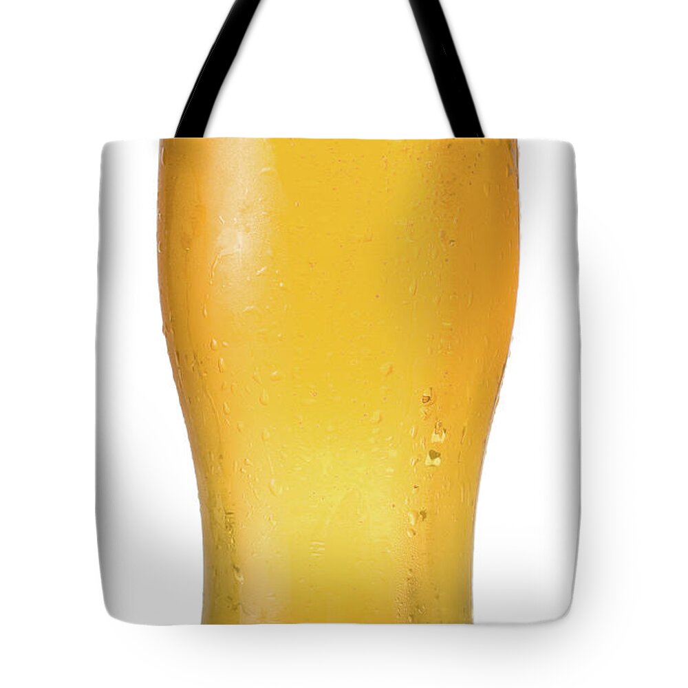 White Background Tote Bag featuring the photograph Pint Of Beer On A White Background by Lleerogers