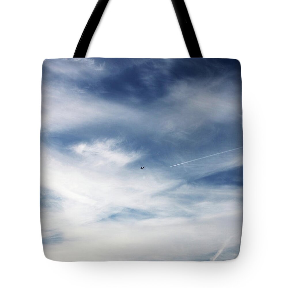 Tranquility Tote Bag featuring the photograph Plane In Flight by Richard Newstead