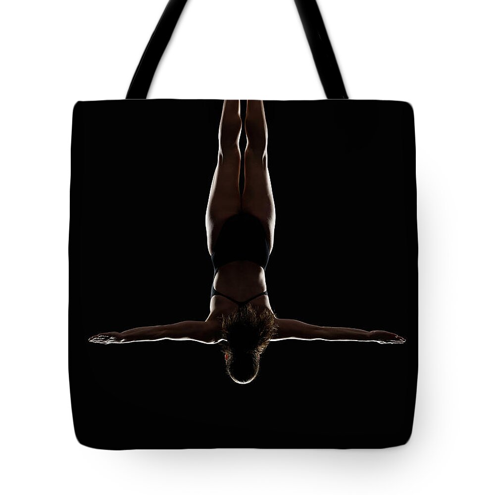 People Tote Bag featuring the photograph Platform High Diver Pre-entry Cruciform by Lewis Mulatero