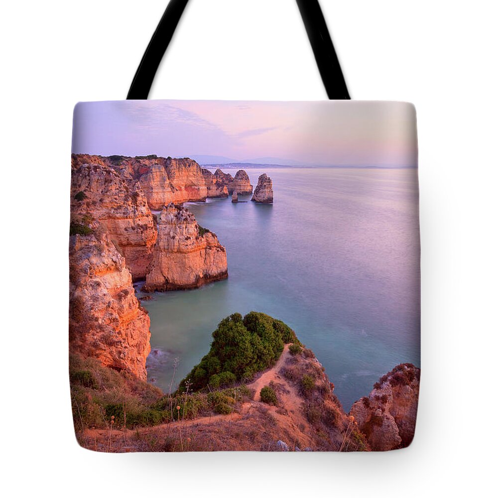 Algarve Tote Bag featuring the photograph Ponta Da Piedade Sunrise by M Swiet Productions