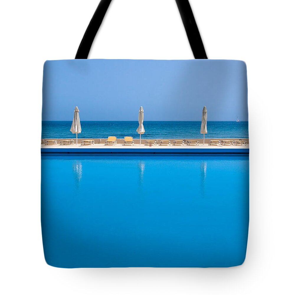 Chaise Longue Tote Bag featuring the photograph Pool Near The Sea by Mixmike