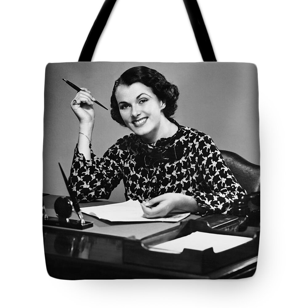Corporate Business Tote Bag featuring the photograph Portrait Of Businesswoman At Desk by George Marks