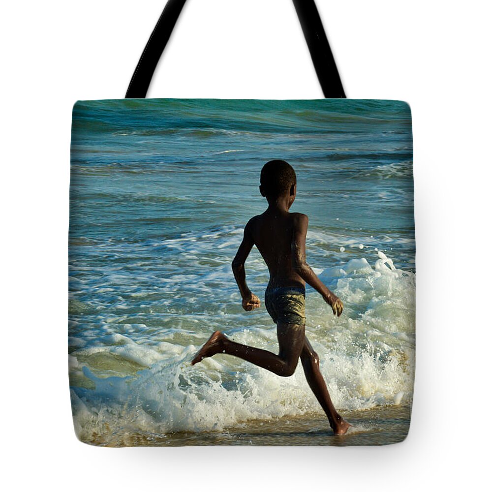 Racing Tote Bag featuring the photograph Racing with the waves by Yavor Mihaylov