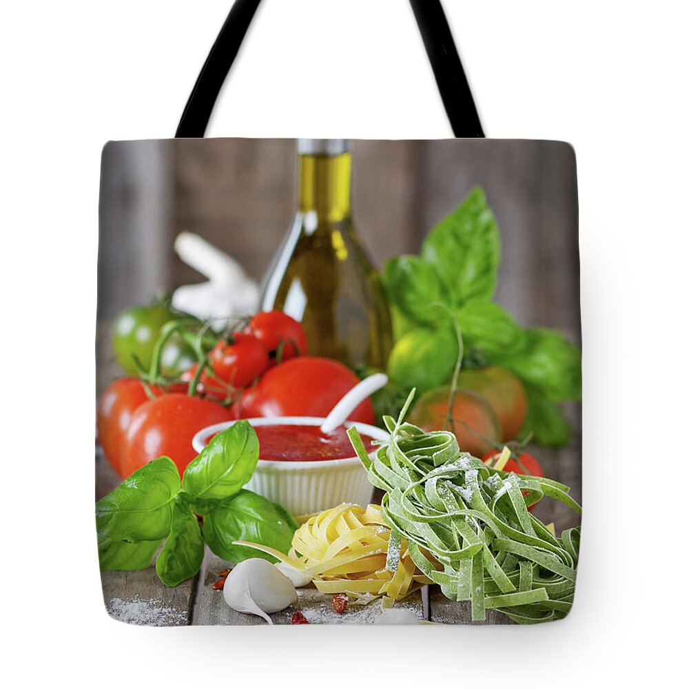 Italian Food Tote Bag featuring the photograph Raw Pasta And Vegetable by Oxana Denezhkina