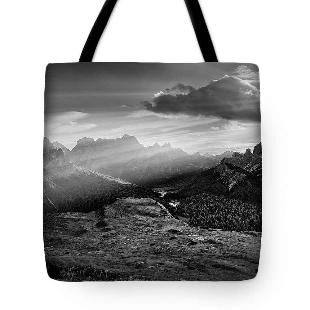 Black And White Tote Bag featuring the photograph Rays over the Dolomites II by Jon Glaser