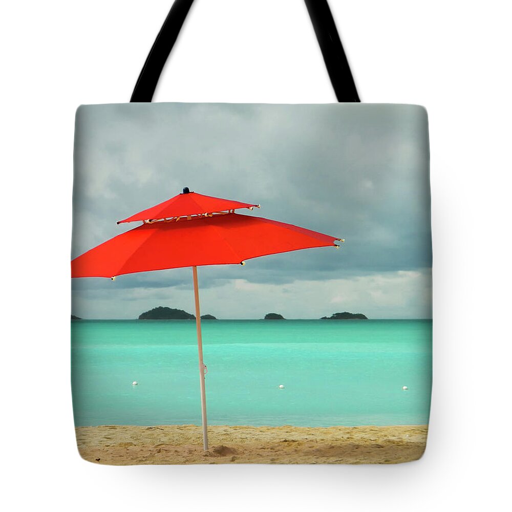 Tranquility Tote Bag featuring the photograph Red Beach Umbrella In The Caribbean by Photo By Sam Scholes