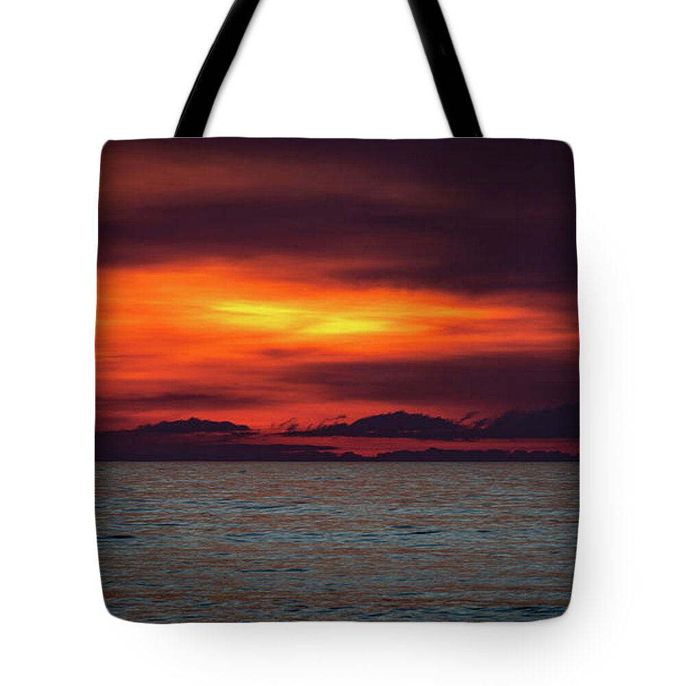 Ocean Tote Bag featuring the photograph Red Hot Sunrise by Lora J Wilson