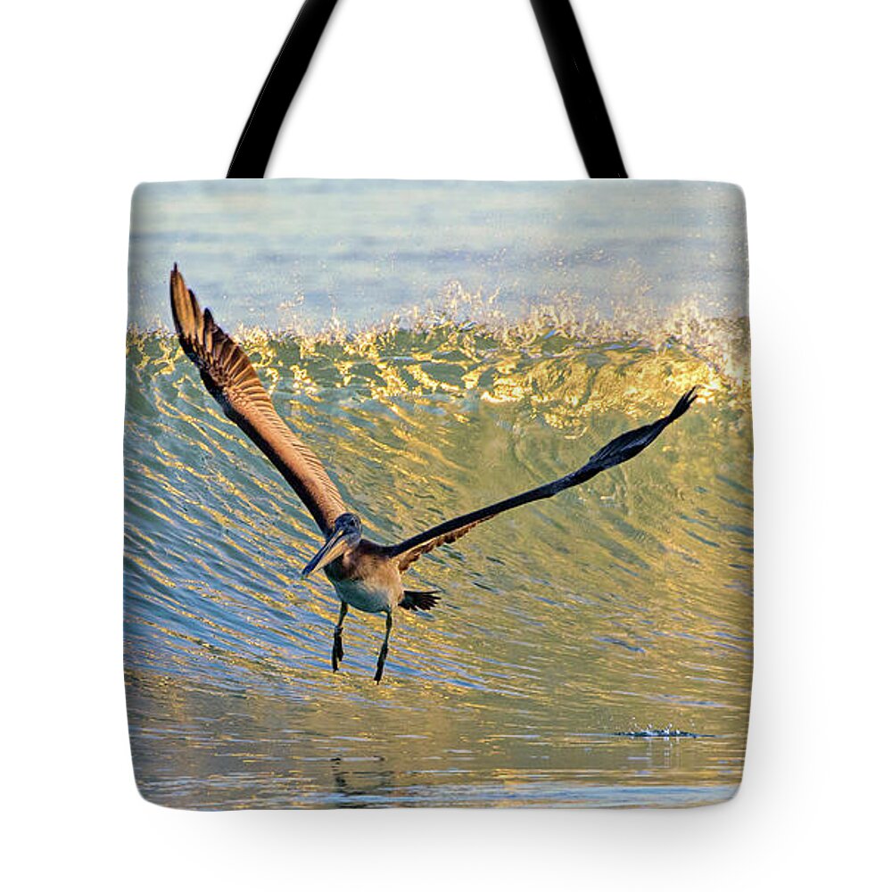 Sunset Tote Bag featuring the photograph Riding the waves by DJA Images