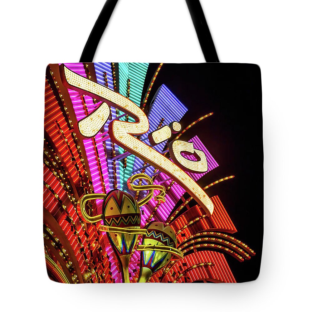 The Rio Tote Bag featuring the photograph Rio Casino Sign at Night low Angle from the North West by Aloha Art