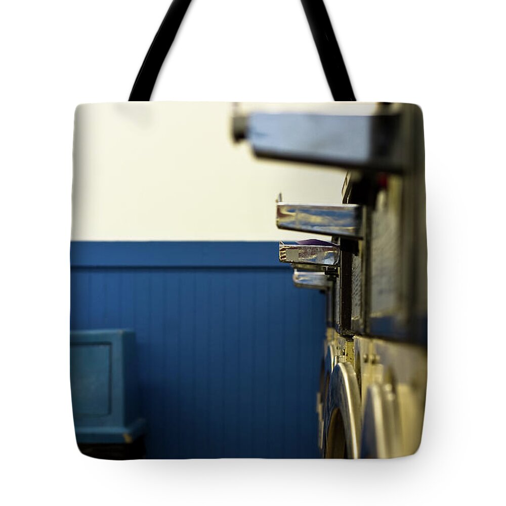 Laundromat Tote Bag featuring the photograph Row Of Washing Machines In Laundromat by Meera Lee Sethi