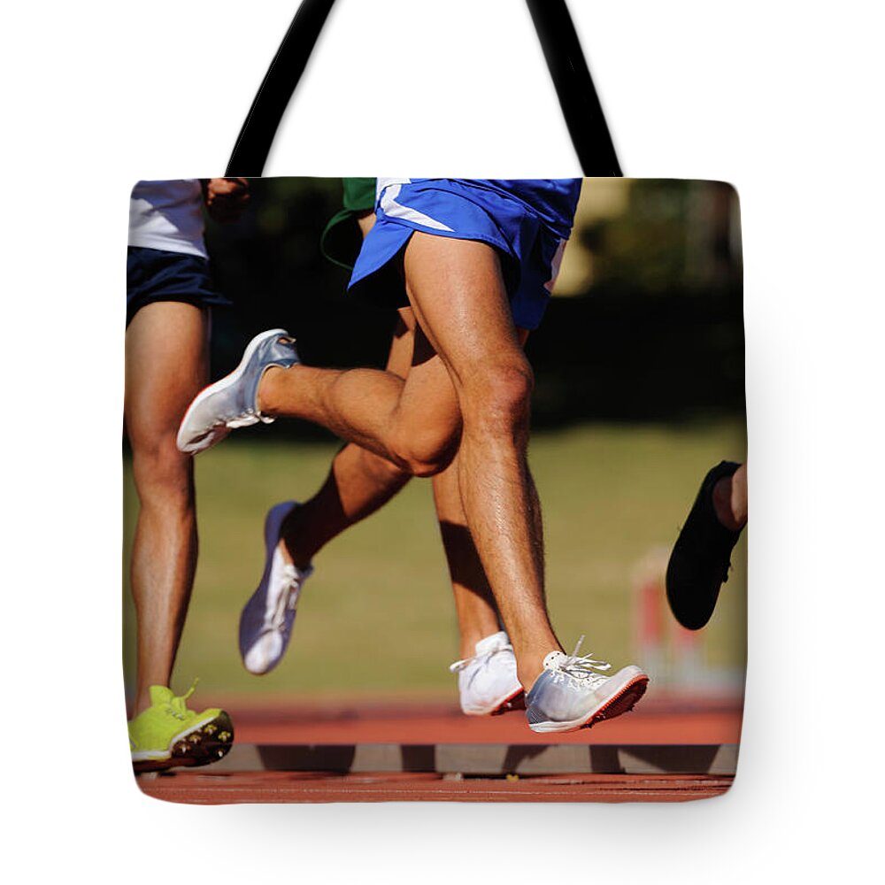 People Tote Bag featuring the photograph Running At The Track by Matt brown